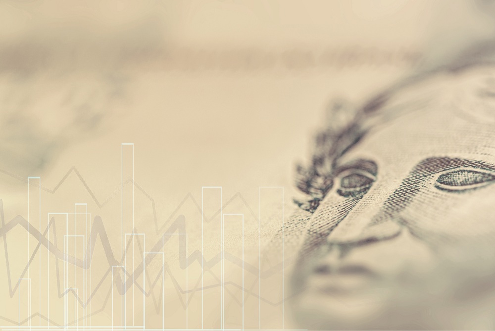 Detalhes da nota real, dinheiro do brasil, foco no local, imagem da bolsa de valores com textura de dinheiro e linhas indicando ascensão e queda